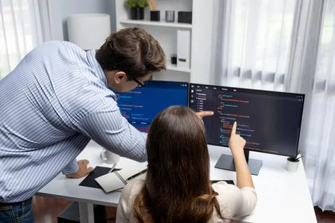 Developers program coding discussing website planning software. Postulate. Stockfoto's