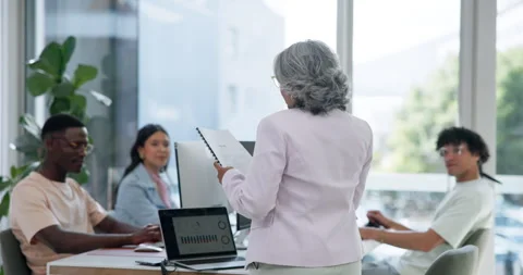Developers, speaking or manager with document in digital agency, project 動画素材 329402807