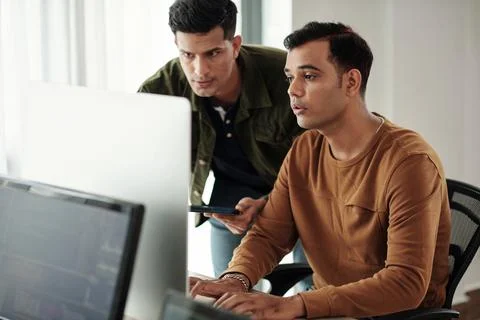 Developers Troubleshooting Issues Stock Photos