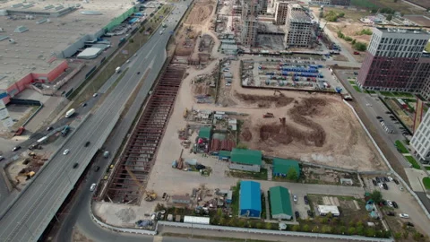 Developing city area shows ongoing work on metro system Stock Footage 294404163