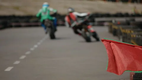 Developing flag on morocycle competition Stock Footage 125471740