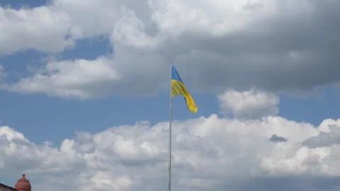 Developing flag of Ukraine in the wind Stockbeeldmateriaal 243827055