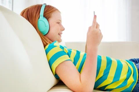 Developing her technological skills. a little girl using a digital tablet with Stock Photos