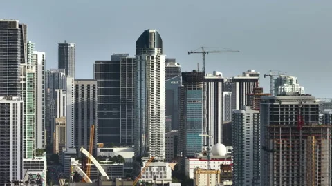 Developing high-rise residences in American urban area. Industrial tower lifting Video stock 276242271