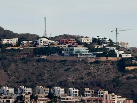 Developing hillside villa communities, evolving residential area with cranes Stock Photos