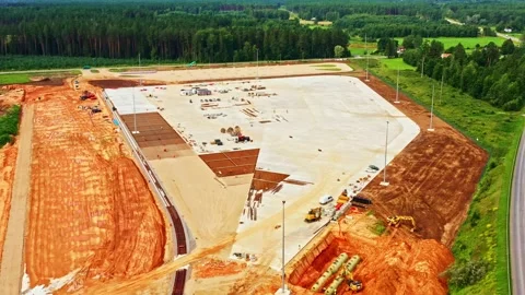 Developing large commercial complex near a highway, earthmoving equipment Stock Footage 328390799