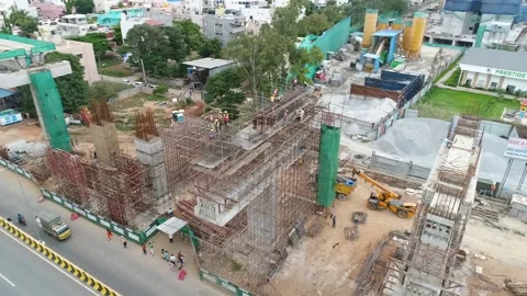 Developing nation flyover construction in Bangalore Peenya India aerial Stock Footage 132379831