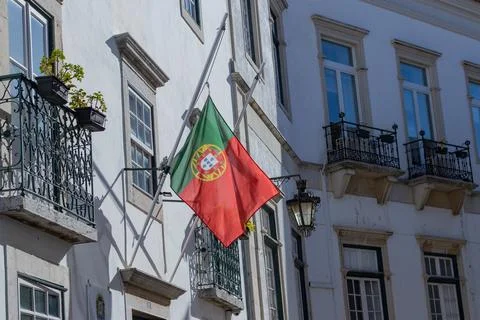 Developing Portuguese flag on the building. the flag of Portugal. Stock Photos