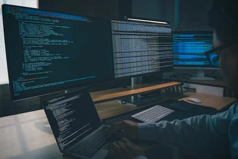 Developing programmer Website design at a multi monitor workstation with la.. Stock-Fotos