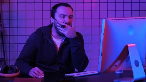 Developing programming and coding technologies. Bored programmer working. Stock Photos