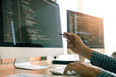 Developing programming working in a software engineers code tech applicatio.. 库存照片