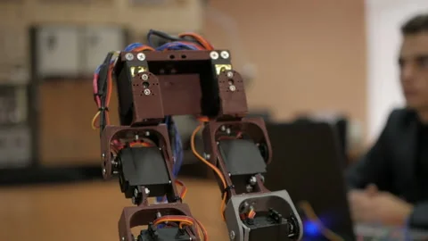 Developing a robot for young scientists. The legs of the robot. Robo technology. Stock-Footage 98742940