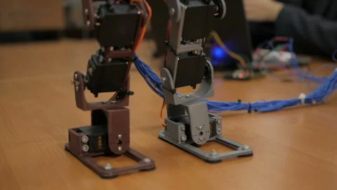 Developing a robot for young scientists. The legs of the robot. Robo technology. Stock-Footage 98743281