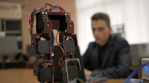 Developing a robot for young scientists. The legs of the robot. Robo technology. Stock-Footage 98747070