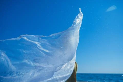 Developing a scarf on the background of blue sky Фото