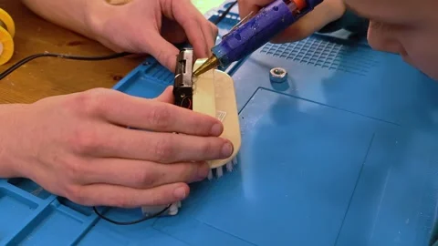 Developing scientific technical creativity. A child designs a moving toy car. Stock-Footage 291439896
