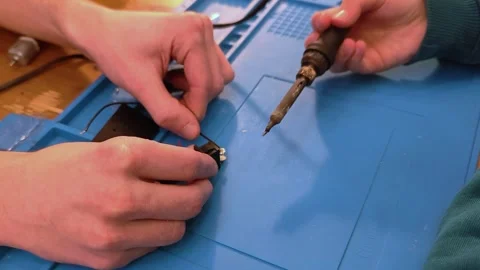 Developing scientific technical creativity. A child designs a moving toy car. Stock Footage 291441379