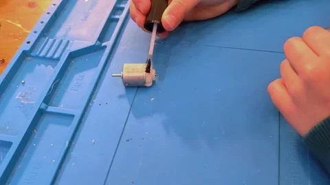 Developing scientific technical creativity. A child designs a moving toy car. Stock-Footage 291711133