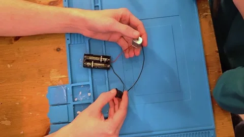 Developing scientific technical creativity. A child designs a moving toy car. Stock Footage 293224411