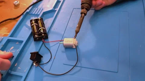 Developing scientific technical creativity. A child designs a moving toy car. Stock Footage 293303091