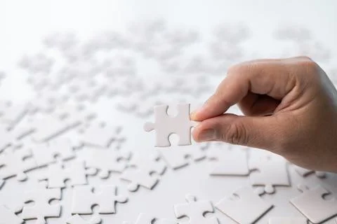 Developing strategic approach to each challenge in business is like piecing.. Stock Photos