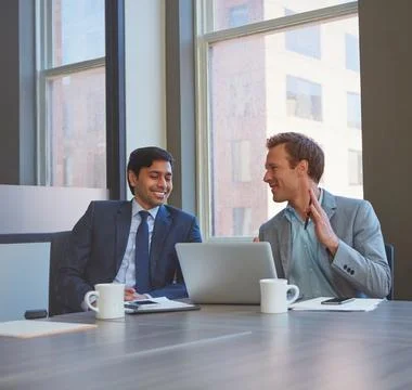 Developing their ideas together. businessmen working in their office. Stock Photos