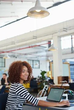 Developing tomorrows tech today. a designer at their workstation in an office. Stock Photos