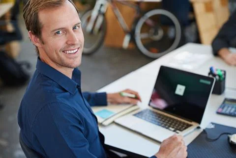 Developing tomorrows tech today. a designer at their workstation in an office. Stock Photos
