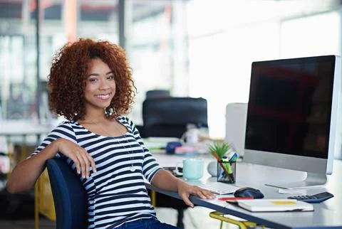 Developing tomorrows tech today. a designer at their workstation in an office. Stock Photos