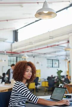Developing tomorrows tech today. a designer at their workstation in an office. Stock Photos