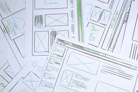 Developing UI design. Sketches of website wireframes as background, top view Stockfoto's