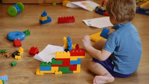 Development and construction concept. Kids play room. Child playing building Stock Footage 139620524