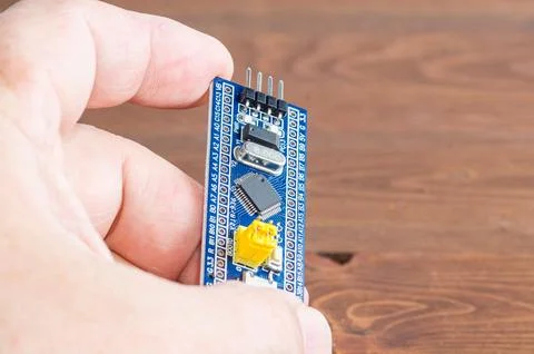 Development board STM and programmer in hand Stock-Fotos