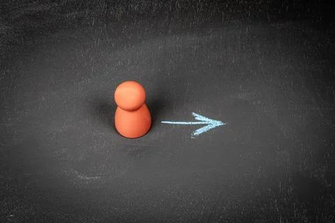 Development concept. Wooden human figures on a chalkboard background Foto stock