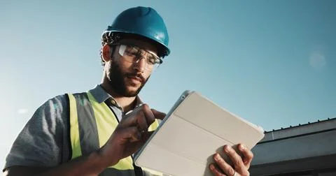 Development, engineer and man with tablet outdoor, building construction and Stock Photos
