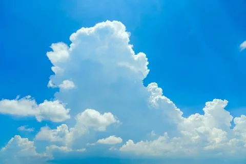 The development growth of powerful cumulus clouds in the summer sky in hot .. Stock Photos