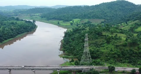 Development In The Rainforest, Aerial Shot Over Power Lines In Forest &amp; Bridge Stock-Footage 154846747