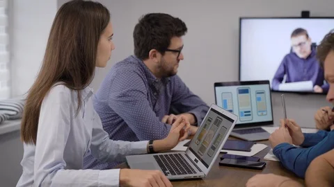 Development team of applications for smartphones are having video conference Stock-Footage 120404568
