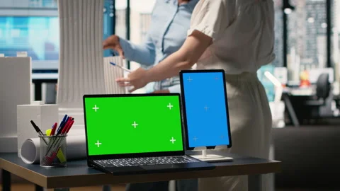 Development team evaluates 3D building models next to copy space Stock Footage 316793204