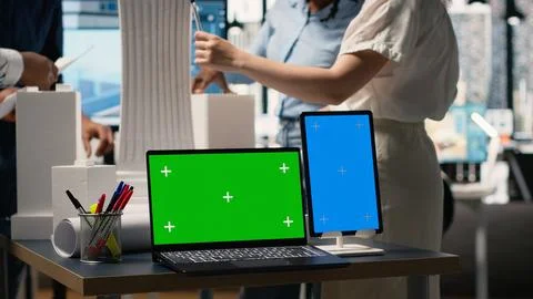 Development team evaluates 3D building models next to copy space Foto stock