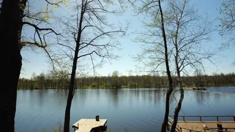 Development of the territory of the fishing lake. Spring nature. Family vacation Stock Footage 274413852