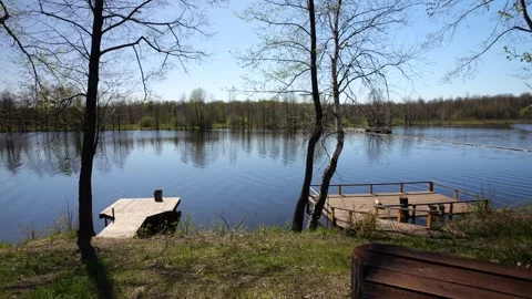 Development of the territory of the fishing lake. Spring nature. Family vacation Stock Footage 274413860