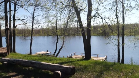 Development of the territory of the fishing lake. Spring nature. Family vacation Stock Footage 274414028