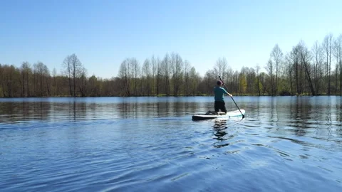 Development of the territory of the fishing lake. Spring nature. Family vacation Stock Footage 274414036