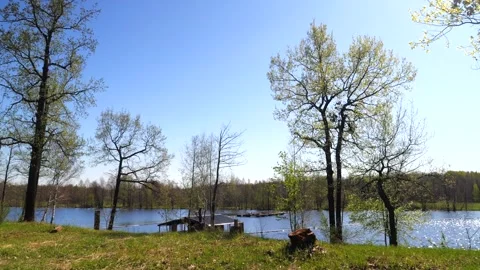 Development of the territory of the fishing lake. Spring nature. Family vacation Stock Footage 274414060