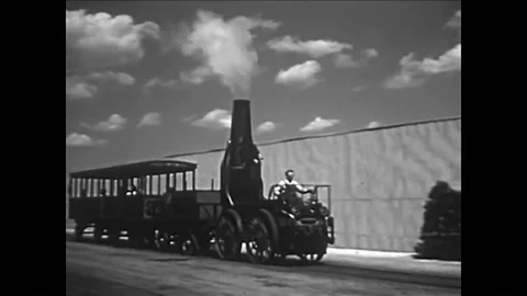 The development of trains, a farmer plowing, factories, mining, a port, a ship Stock Footage 85771365