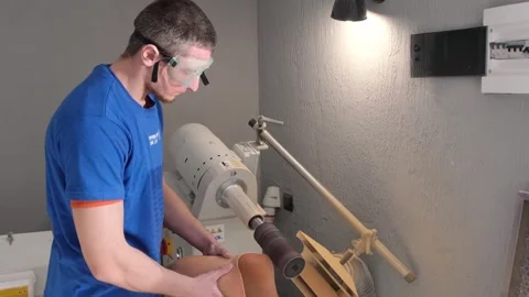 Development of a working, fixing mechanism for a new prosthesis in the workshop. Stockbeeldmateriaal 269373826