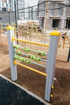 Developmental playground with construction cranes and site in the background Stock Photos