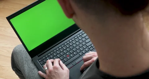 Develper writing sql code in monitor working from home Stock Footage 243624705