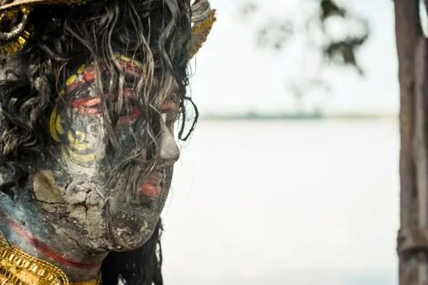 A Devi Maa Durga sadly looks down with tousled hair while tears flow the eyes Stock Photos